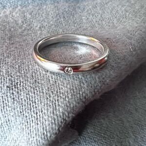 Tiffany & Co. Silver Band Ring with Single Diamond Accent